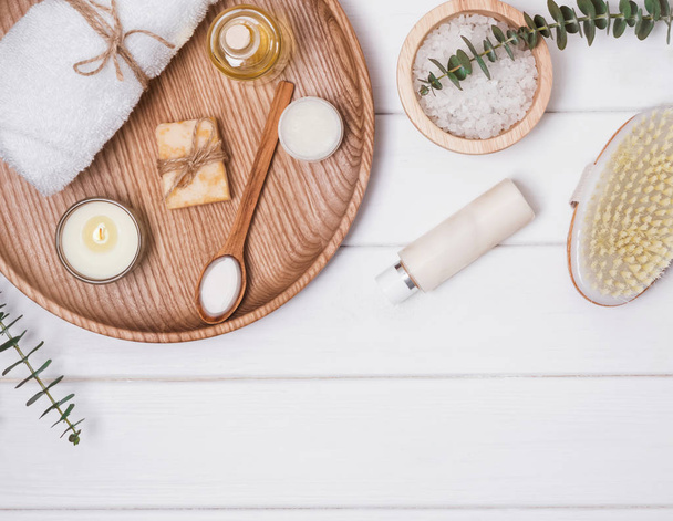 Cosmetics and accessories for body care on the white wooden table. - 写真・画像