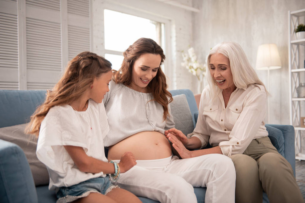 Grandmother and daughter taking care of pregnant woman - Foto, Bild