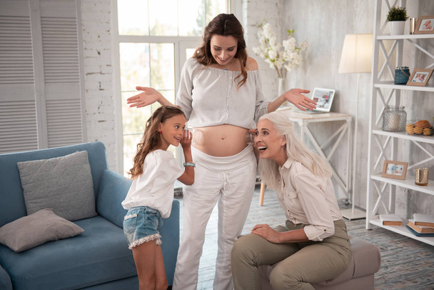 Stylish expecting woman having fun with her family - Foto, Imagem