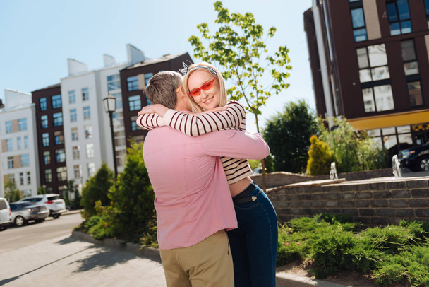 Positive cheerful woman hugging her husband - Foto, immagini
