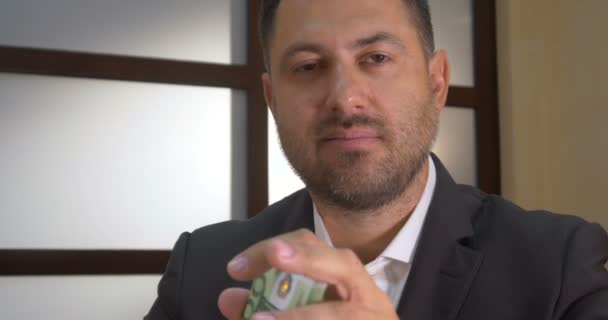 Successful businessman counts money - Footage, Video