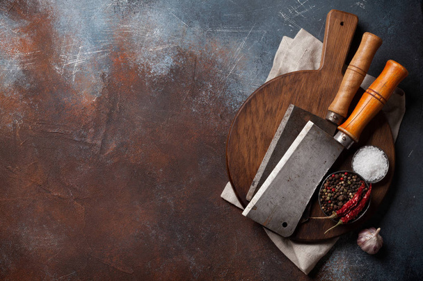 Butcher. Vintage meat knives and spices over cutting board. Top view with space for your text - Fotoğraf, Görsel