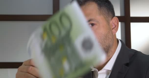 Happy man with money. Business man scattering money - Footage, Video