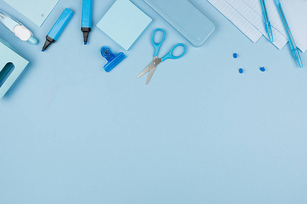 Pastel blue office stationery collection on soft elegance blue background with copy space, top view. - Fotó, kép