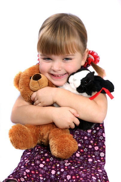 Girl embracing favorite toys - Photo, image