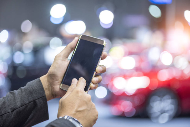 hands using digital smartphone with intelligent car - Foto, imagen