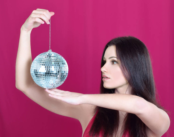 stylish young woman with a mirror ball - 写真・画像