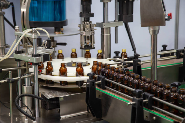 Production line of liquid filling and capping bottle machine - Photo, Image