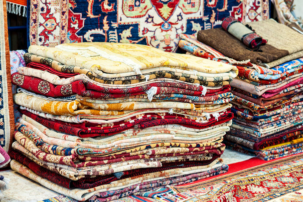 Carpets variety selection rolled up rugs shop store. - Photo, Image