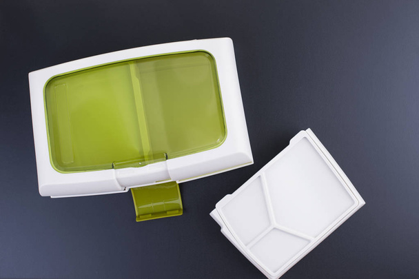 A set of clean plastic lunchboxes. Trend for the office. Black background. New dishes. Copy space. - 写真・画像