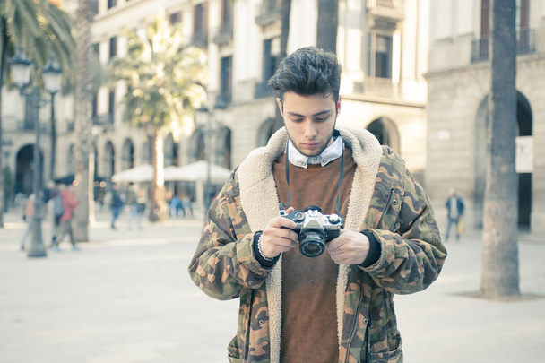 handsome young man taking pictures at the street - Foto, Imagem
