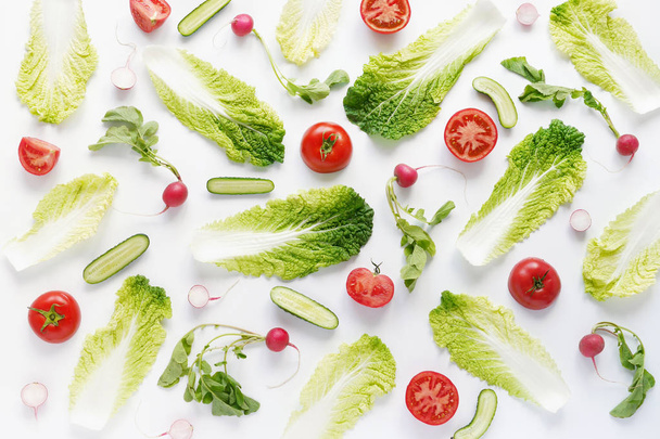 Seamless pattern made of chinese cabbage, radishes, cucumbers, tomatoes and onions isolated on white background - Fotó, kép