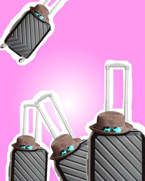 suitcases. stickers. pink background. different suitcases on wheels. travel with luggage. clothes in the middle - Foto, Imagem