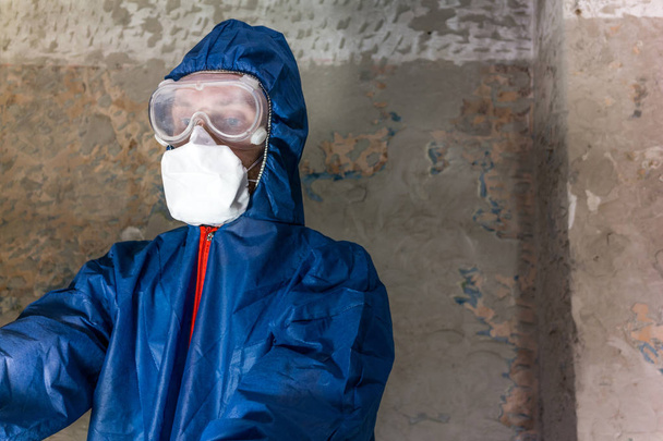 A man in blue one protective suit - Photo, Image