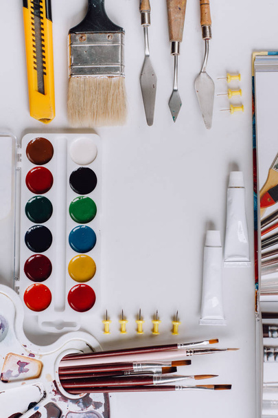 Back to school. Items for the art school on a white wooden table - 写真・画像
