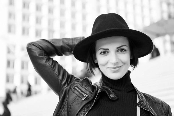Fashion, accessory, style. Sensual woman with brunette hair, hairstyle. Beauty, look, makeup. Skincare, youth, visage. Woman in black hat smile on stairs in paris, france, fashion - Φωτογραφία, εικόνα