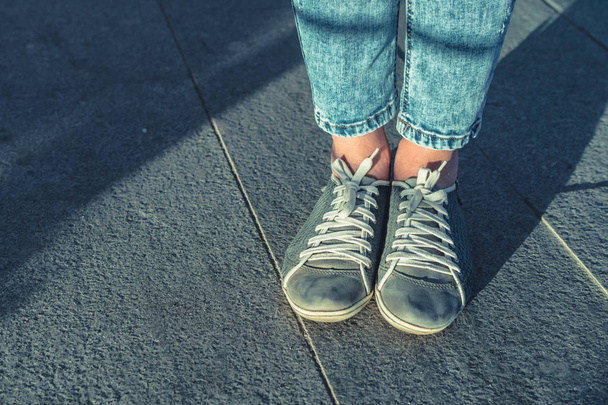 Woman in blue denim jeans leg in shoes - Photo, Image