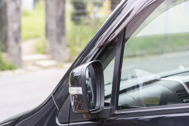 Closeup of car rear view mirror at daytime - Фото, зображення