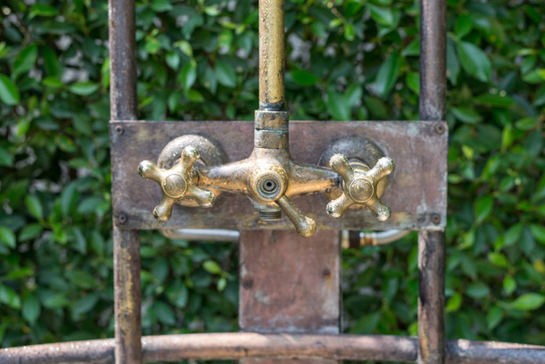 Vintage bronze shower faucet of hot and cold water - Photo, Image