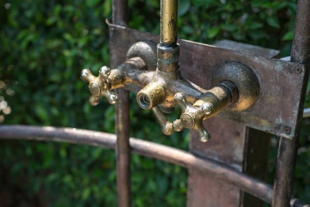 Vintage bronze shower faucet of hot and cold water - Photo, Image