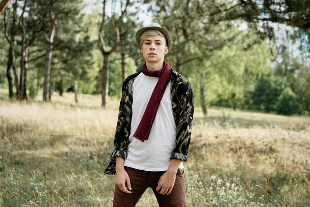 stylish young man posing outdoors  - Photo, Image
