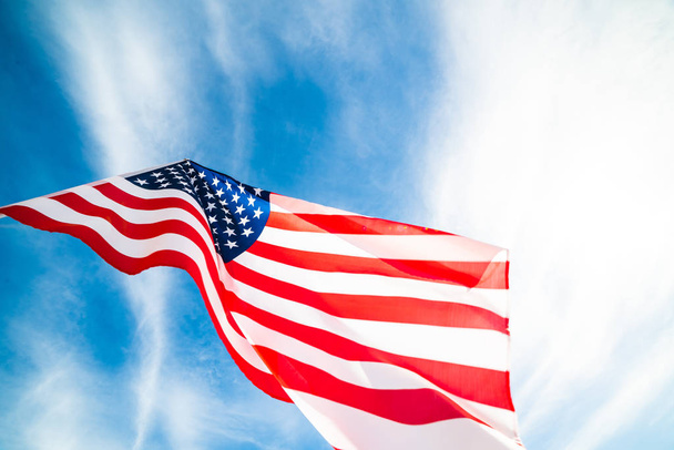 Close up United States of America flag on the blue sky background. USA Independence day, 4 July. - Foto, Imagen