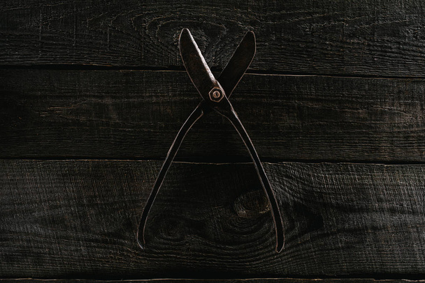  top view of retro scissors on wooden tabletop background - Photo, Image