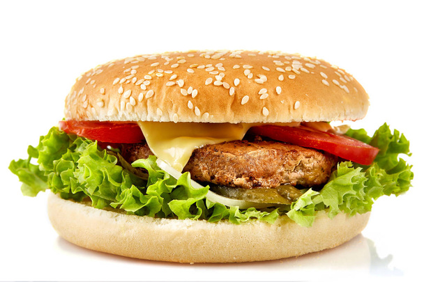 チーズ、ベーコン、ピクルス、トマト、オニオンとレタス白い背景の上では完璧なハンバーガー. - 写真・画像