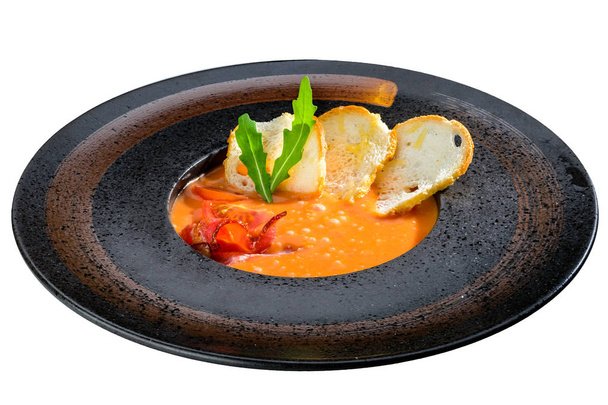 Delicious pumpkin and carrot soup with tomatoes and meat, served - Foto, Imagem