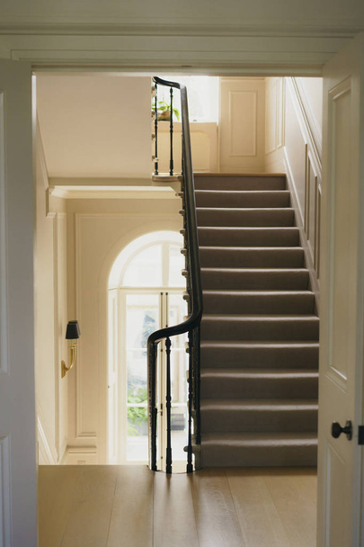 Stairs in the house, handrail, window and floor - Фото, зображення