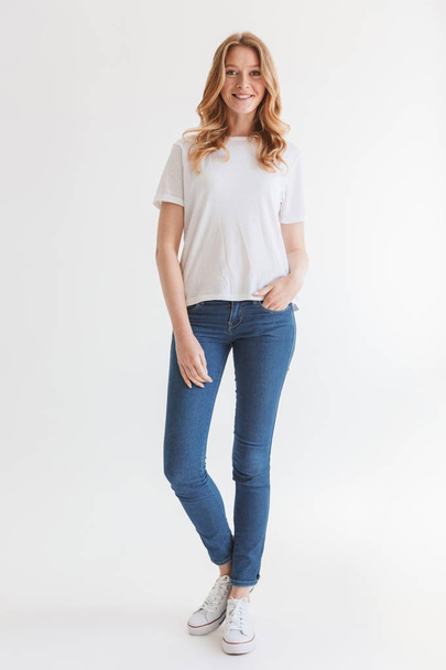 Image of pretty young cute redhead woman isolated over white wall background looking camera. - 写真・画像