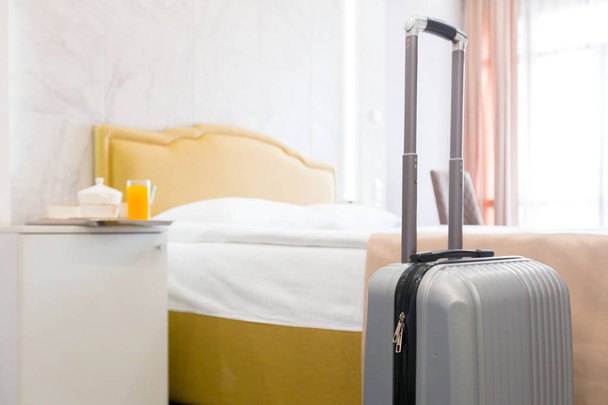 Suitcase or luggage bag in a modern hotel room - Foto, Imagen