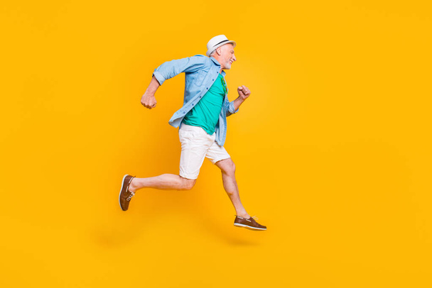 Healthcare cardio motion studio joy fun freedom concept. Profile full length size view photo portrait of cheerful joyful funny with bristle rejoicing gentleman running in space isolated background - Fotografie, Obrázek