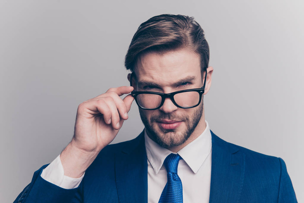 Suspicion proud respect distrust hesitate manipulate people person agent concept. Close up portrait of self-assured handsome confident recruiter touching glasses looking you isolated gray background - Фото, изображение