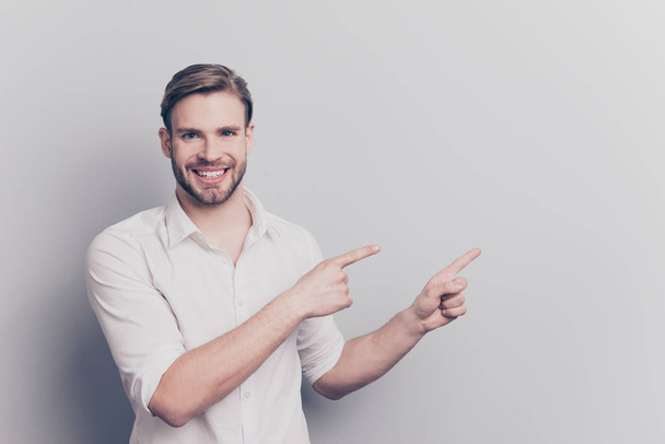 Look attention ! Leave your feedback here! People service tips concept. Portrait of confident excited handsome experienced manager pointing on empty blank place text isolated gray background copyspace - Foto, Bild