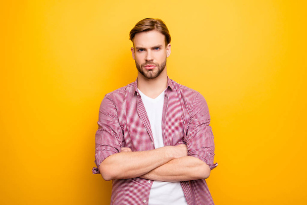 Bad day people person concept. Portrait of serious pensive focused sad upset handsome attractive virile masculine boy standing with crossed hands isolated on bright background copyspace cutout - Photo, Image
