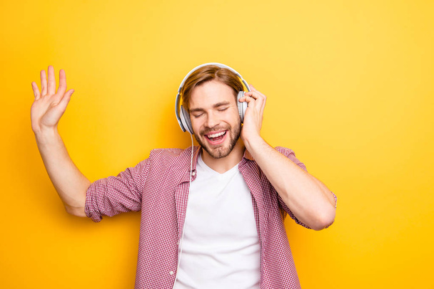 Song people person euphoria rhythm concept. Portrait of handsome cheerful excited relaxed active satisfied attractive rejoicing stylish trendy guy listening to track tune music isolated background - Fotoğraf, Görsel