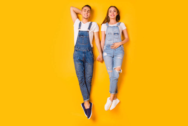 Happiness leisure trampoline concept. Above high angle overhead full length size photo of two attractive careless jumping cute lovely siblings having break isolated bright background - Fotoğraf, Görsel