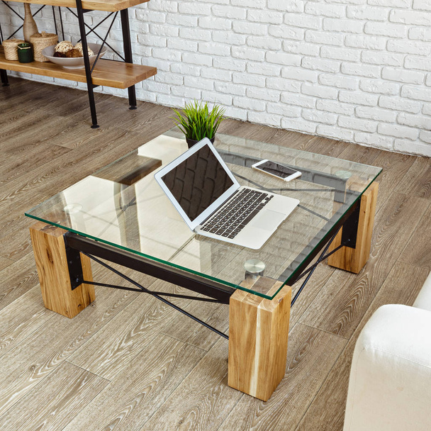 modern glass table with laptop  in the loft interior - Zdjęcie, obraz