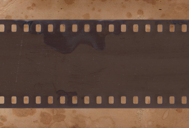 Vintage background with aged retro paper and old film strip - Photo, Image