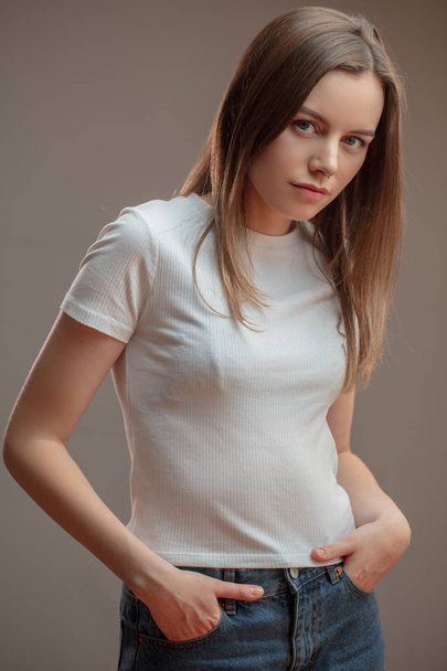confident attractive model with hands on the pockets - Fotoğraf, Görsel