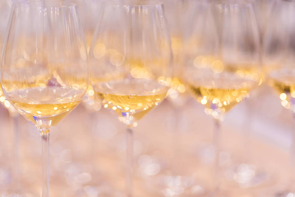 Alcoholic drink in a glass. It is a lot of glasses with champagne - 写真・画像
