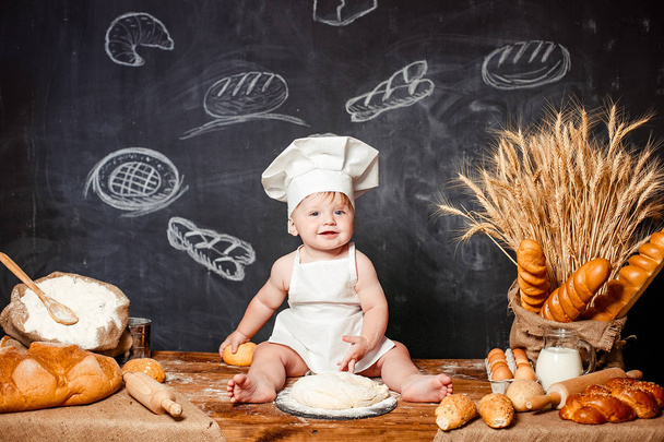 Adorable infant on table with dough - Φωτογραφία, εικόνα