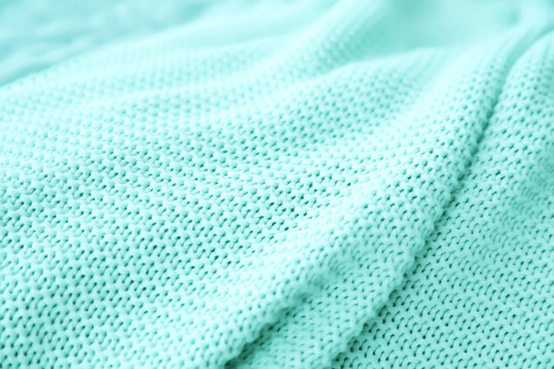 Texture of warm knitted mint blanket, closeup - Foto, afbeelding
