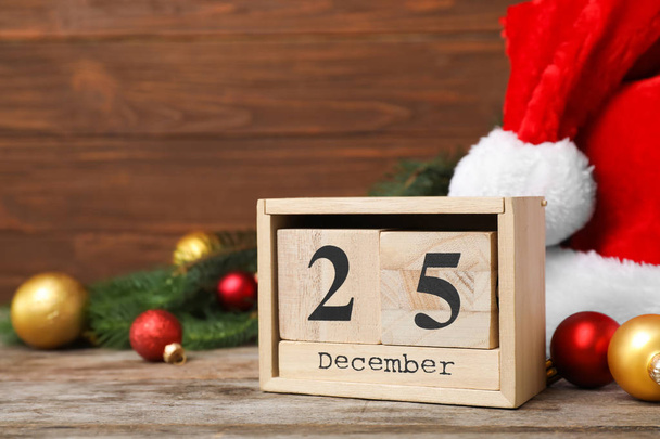 Wooden block calendar and decor on table. Christmas countdown - Zdjęcie, obraz