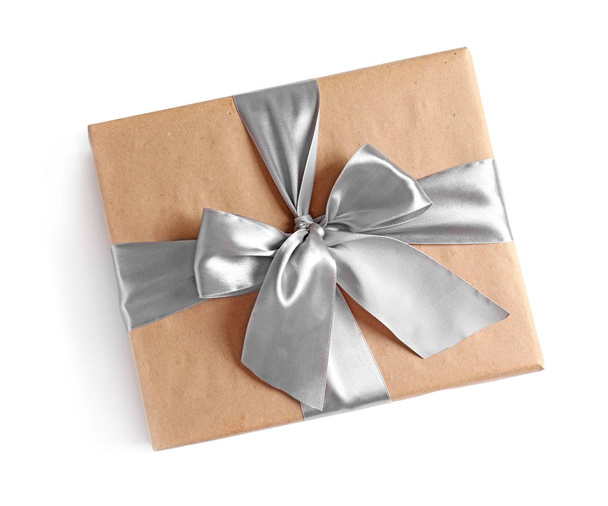 Beautifully wrapped gift box on white background, top view - Foto, imagen