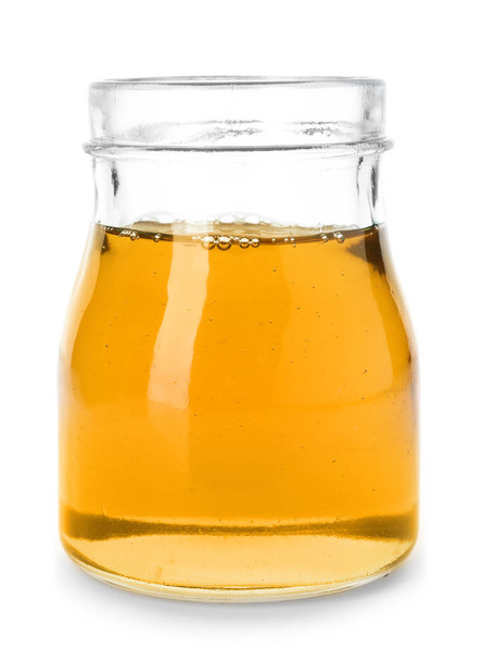 Jar with delicious honey on white background - Foto, Imagem