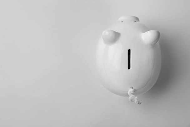 Cute piggy bank on white background, top view - Zdjęcie, obraz