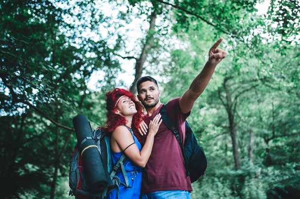 Young happy couple enjoying together in wild nature.  - Photo, Image