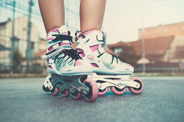 Urban scene of girl with roller skates. - Photo, Image